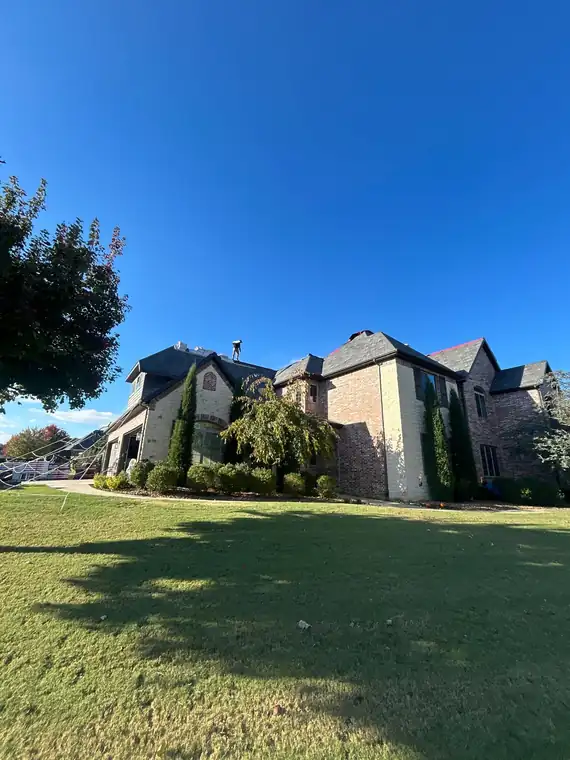 Finished Midcon Exteriors roof on a large home in Centerton