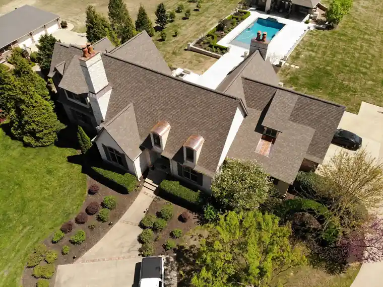 Aerial photo of a finished Midcon roof on a Northwest Arkansas home