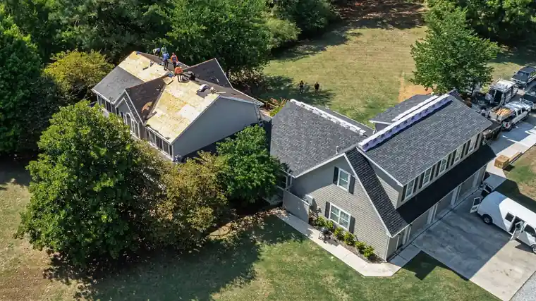 Aerial view of a Midcon crew working on neighboring roofs
